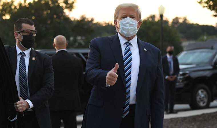 Donald Trump wearing a surgical mask giving a thumbs-up