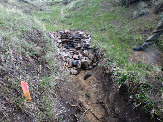 Zuni bowl dam structure in a stream in Montana