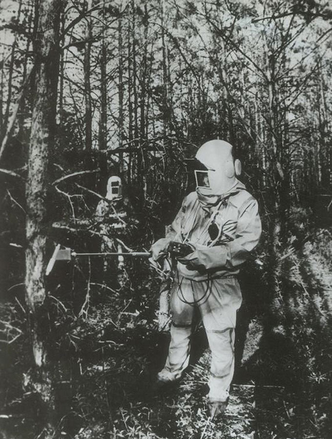 workers measuring radiation in a Chernobyl forest