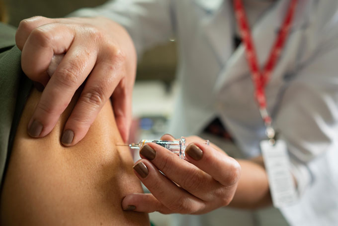 person getting CoronaVac vaccine