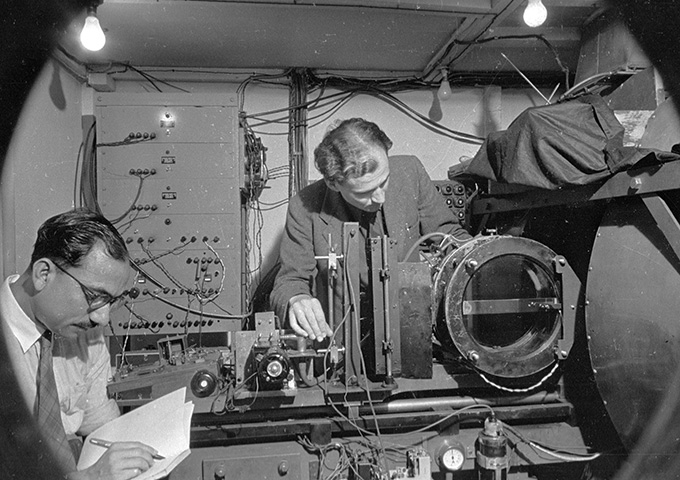 black and white image of Clifford Butler and another scientist working in a lab