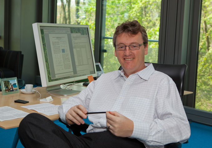 David MacMillan sitting in his office