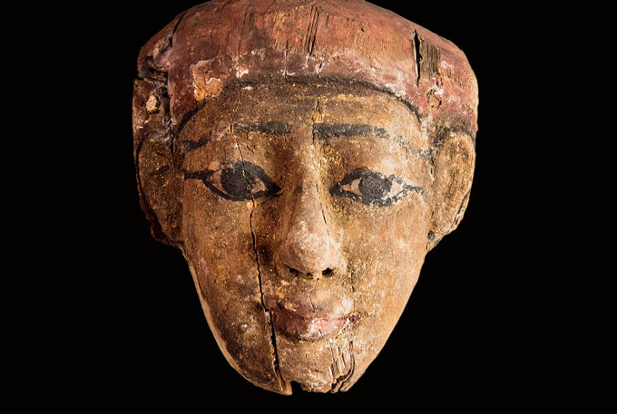 portion of Egyptian coffin depicting a human face